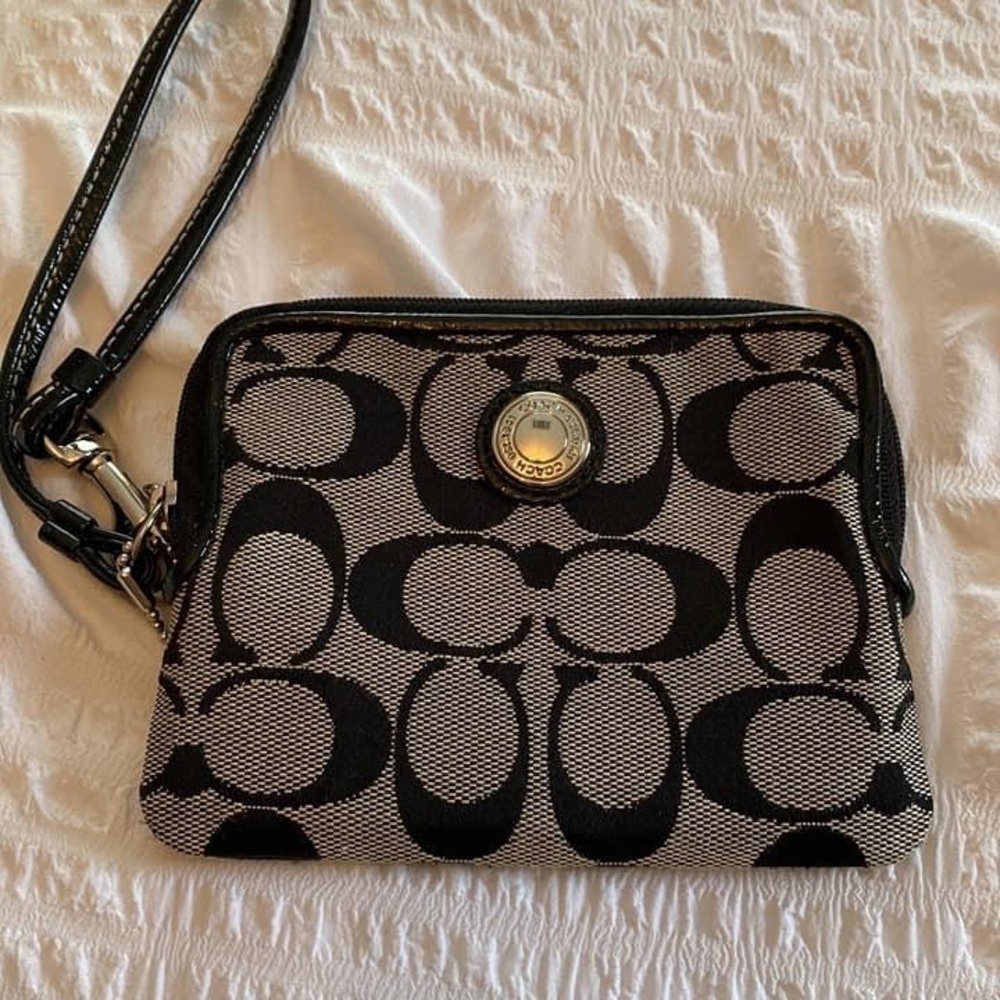 Coach wristlet. Black with hot pink interior.